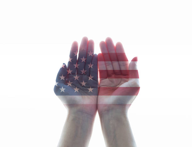 istock America flag pattern on woman's hands with open palms on white background 974660416