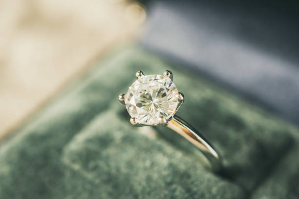 istock luxury engagement Diamond ring in jewelry gift box 974660474