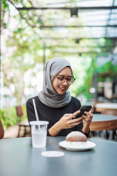 istock Asian businesswoman having breakfast 974663380