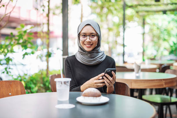 istock Asian businesswoman having breakfast 974663382