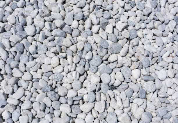 istock White marble stones on artificial marble beach for background 974664182