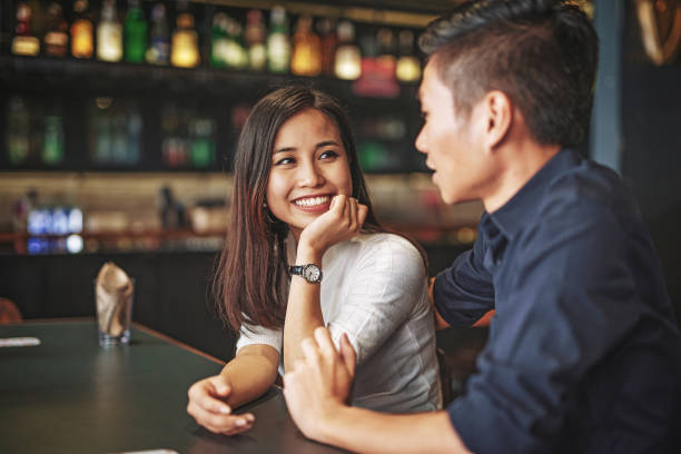 istock Multi ethnic couple waiting for the drink in the bar 974664748