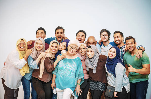 School generation reunion with senior teacher Multi generationa and multi ethnic group of people together teacher retirement party stock pictures, royalty-free photos & images
