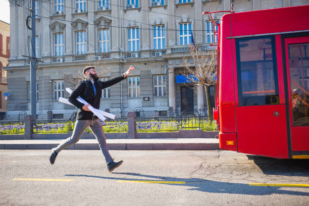 Businessman trying to catch the bus