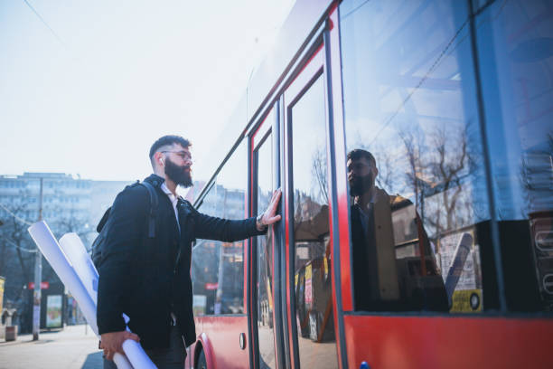 istock Businessman trying to catch the bus 974667358