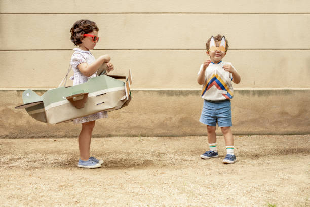 istock Boy and girl arguing over airplane 974671358