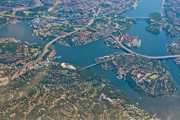 Aerial shot over Stockholm, Essingeleden and Traneberg bridge STOCKHOLM, SWEDEN - JUNE 1, 2018: Aerial shot over Stockholm, Essingeleden and Traneberg bridge to Bromma, during inflight to Arlanda airport on a sunny day on June 1, 20108 in Stockholm, Sweden. sodermalm photos stock pictures, royalty-free photos & images