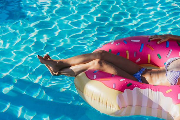 istock Woman resting on inflatable during vacation 974671966
