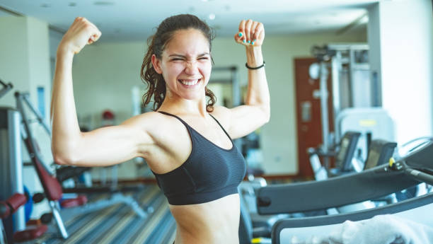 istock Woman shows off her muscle 974672608