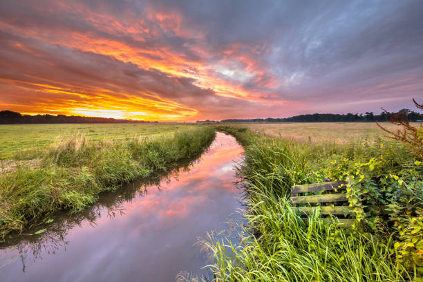 istock Warm indian summer sunrise over lowland river 974676778