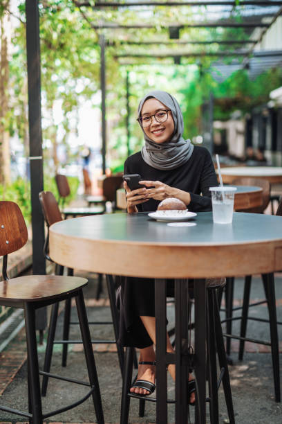 istock Asian businesswoman having breakfast 974679980