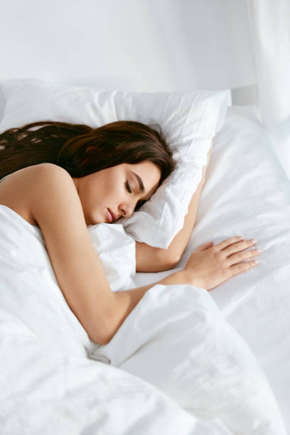 istock Sleep. Young Woman Sleeping In Bed. 974680788