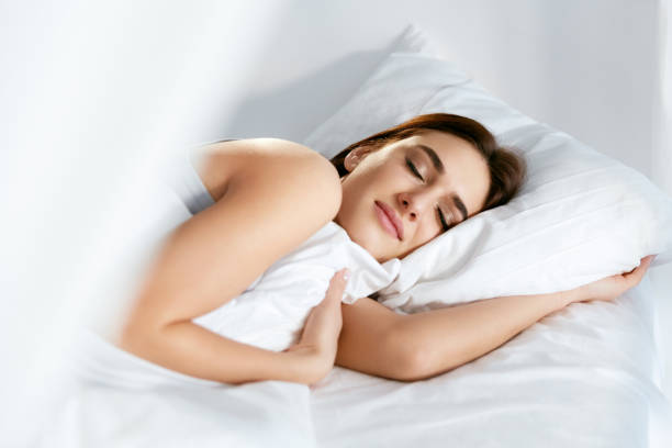 istock Sleep. Young Woman Sleeping In Bed. 974680868