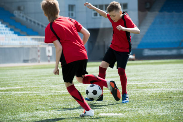 istock Two Children in Football Match 974687916