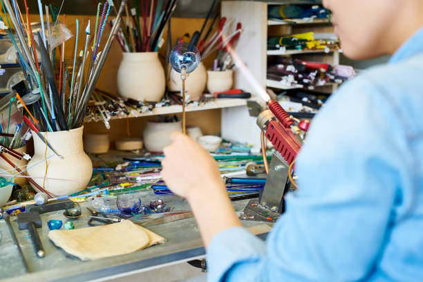 istock Unrecognizable Artist Making Glass Sphere 974688130