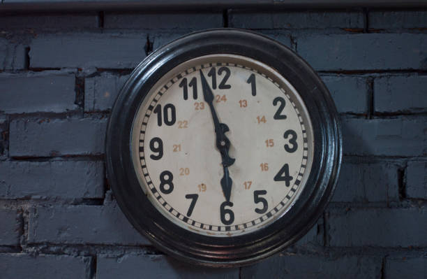 istock Clocks Antique vintage retro styles hanging on the brick wall , with copy space for text. 974691522