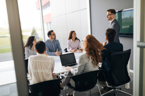 istock Group of business people collaborating in office 974695262