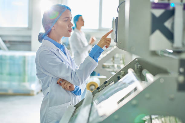 istock Female Worker at Modern Factory 974695304