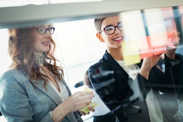 istock Group of business people collaborating in office 974698066