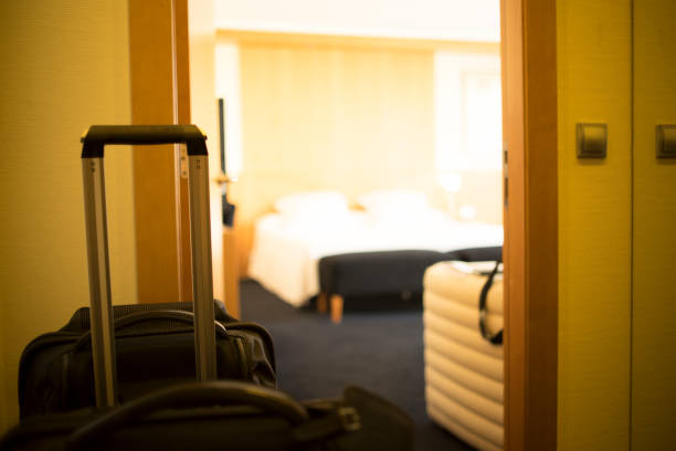 istock Luxury modern style hotel suite bedroom clean and ready for guests. 974698282