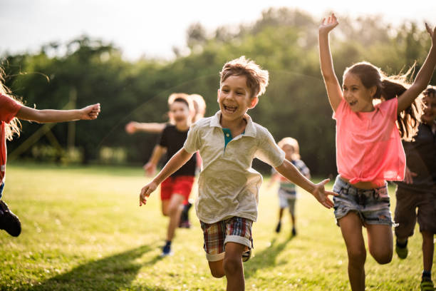 istock Happy children running in nature 974701538