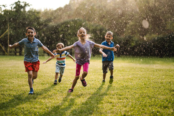 istock Happy kids on the rain 974702192