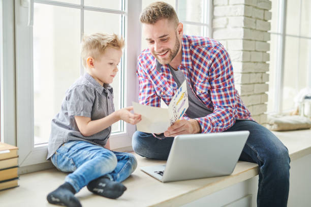 istock Celebrating Fathers Day with Little Son 974702444