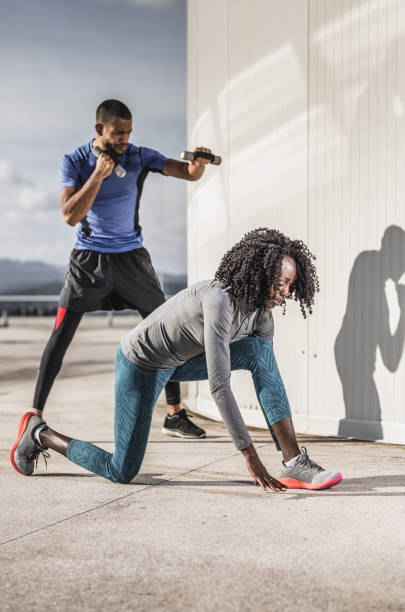 istock Two People Exercising Outdoors 974702560