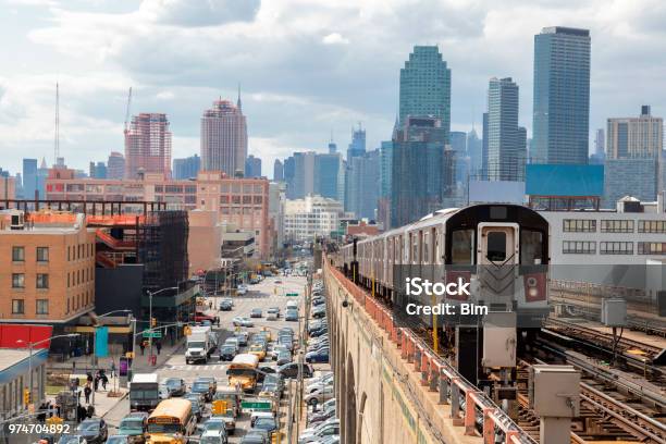 Subway Train Approaching Elevated Subway Station In Queens New York Stock Photo - Download Image Now