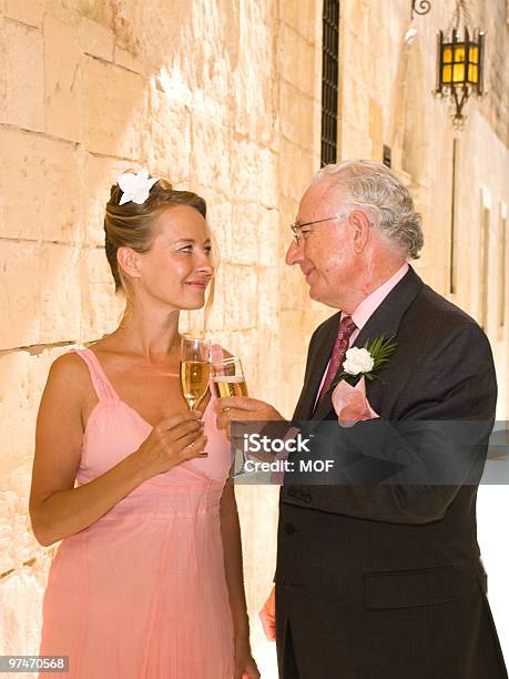 Bride And Groom Toasting Each Other Stock Photo - Download Image Now - 25-29 Years, 50-54 Years, Adult