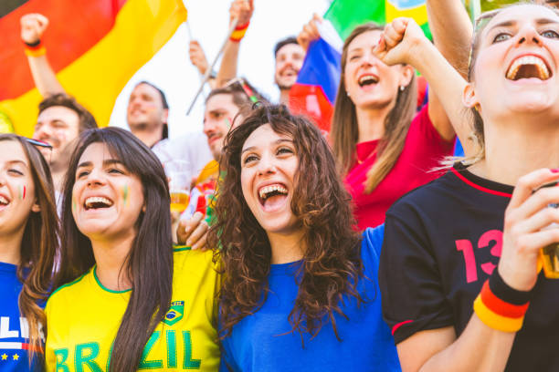 istock Happy fans supporters from different countries together at stadium 974713720