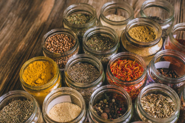 istock Various colorful kinds of spices on rustic wooden table, top view 974714092