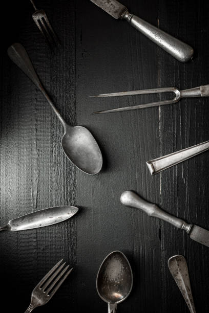 istock Rustic Cutlery on Old Dark Wooden Background. Silverware and Food Concept. 974714112