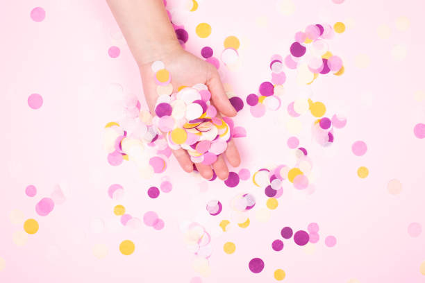 istock View from above on hand with confetti. 974714692