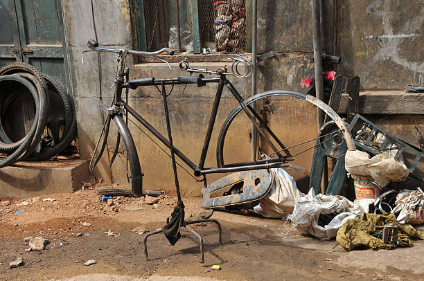 A close-up shot of an old, rusty Indian bicycle.