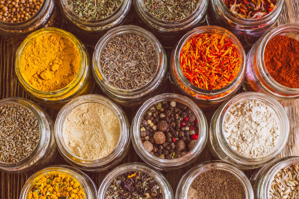 istock Various colorful kinds of spices on rustic wooden table, top view 974718510