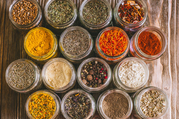 istock Various colorful kinds of spices on rustic wooden table, top view 974718520