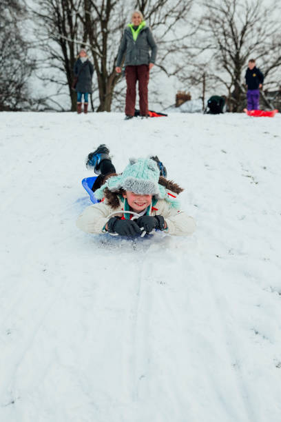 istock Zooming Downhill on a Sled 974718816