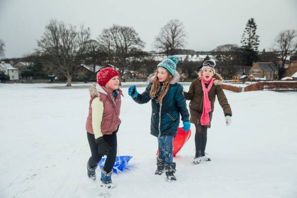 istock Friends Having Fun in the Snow 974719286