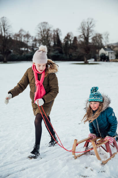 istock Having Fun in the Snow With a Sleigh 974725514