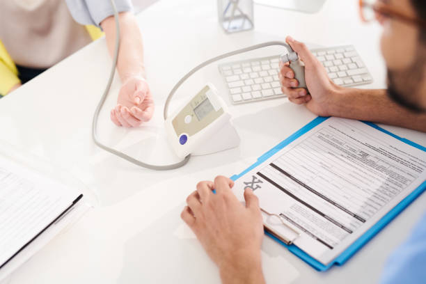 istock Doctor Measuring Blood Pressure 974728606