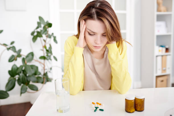 istock Woman Suffering from Headache 974728714