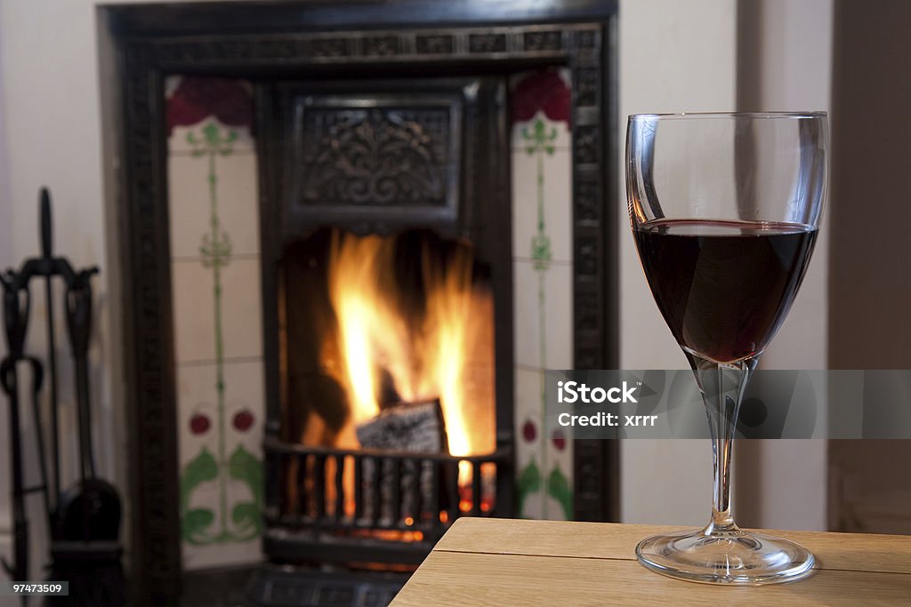 Glass of Wine by the Fire  Color Image Stock Photo