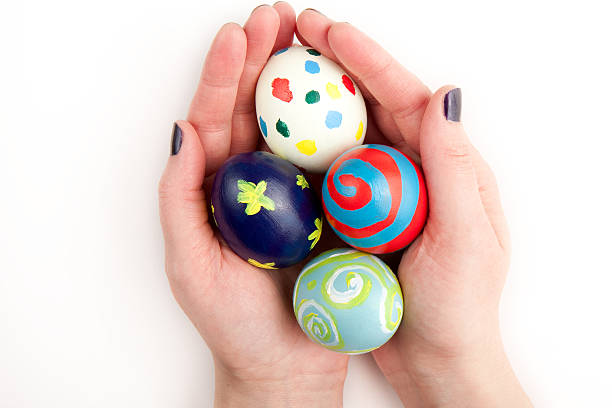 istock Four Colorful Easter Eggs in the Hand 97473526