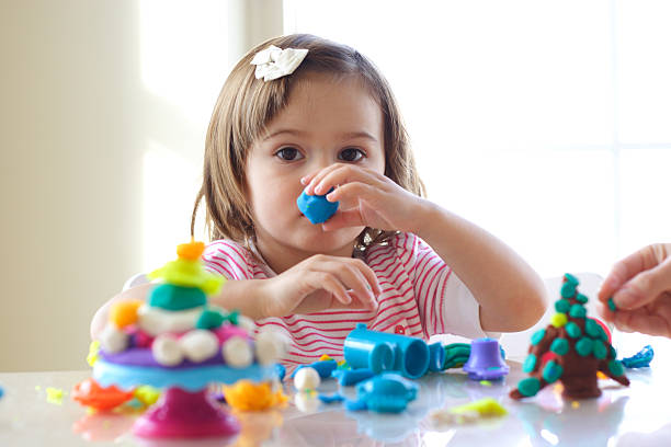 istock Girl playing with play dough 97473538