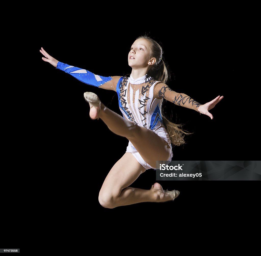 rhythmic gymnastics 12 years old girl doing rhythmic gymnastics Activity Stock Photo