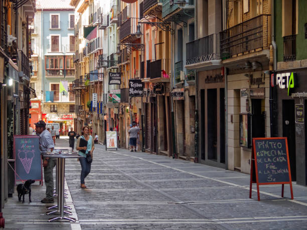 Pamplona, Navarre, Spain - September 4, 2014: Just a few people are out on Estafeta Street (Calle de la Estafeta) during the siesta