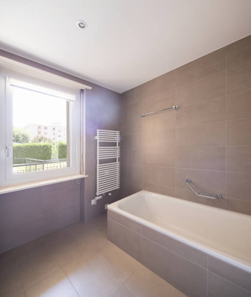 istock Bathroom with large modern tiles 974743050