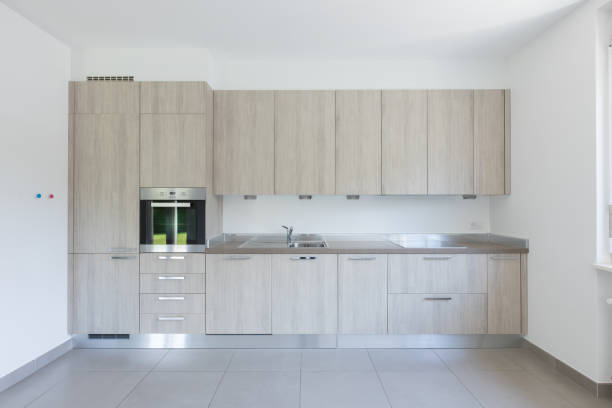 istock Light wood kitchen with white walls 974745300