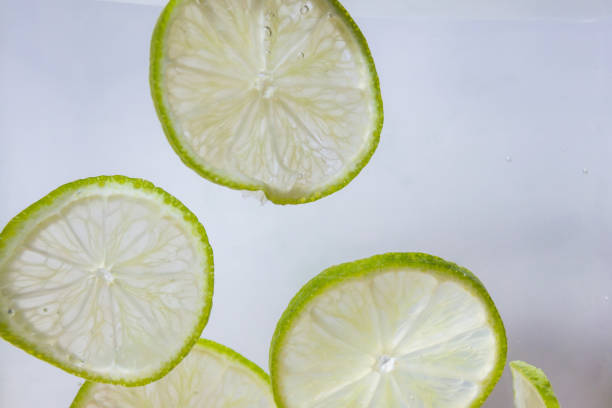 istock Refreshing water with slices of lime 974745410